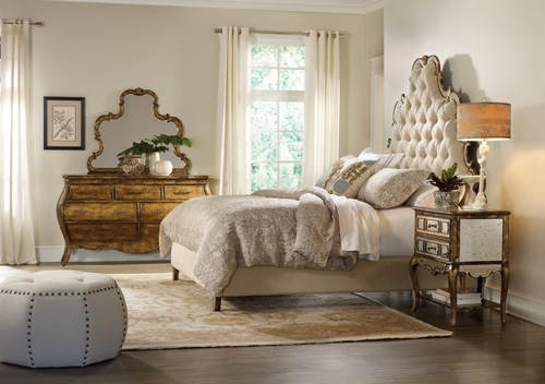 Layering shades of white and neutral and mirrored furniture results in a pleasing and restful space.