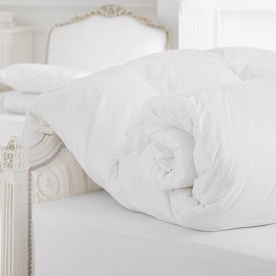 Cloud-like, crisp white down comforters are warm and lightweight, adding to the heavenly experience. (Photo Credit Cologne & Cotton)