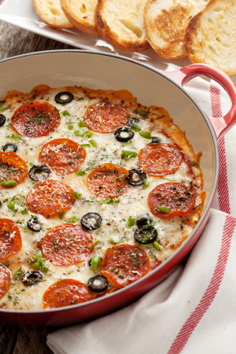One of my all-time favorites (whether I’m hosting or attending) is a Pizza Dip. Image and full recipe: mybakingaddiction.com