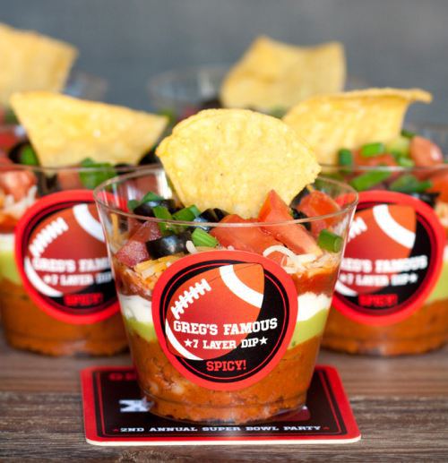 Individual servings—like this seven-layer dip—are fun and practical. You can also serve celery and carrots with ranch dip this way. And for more style, dress up the cup with a custom sticker.  Image: theberry.com.