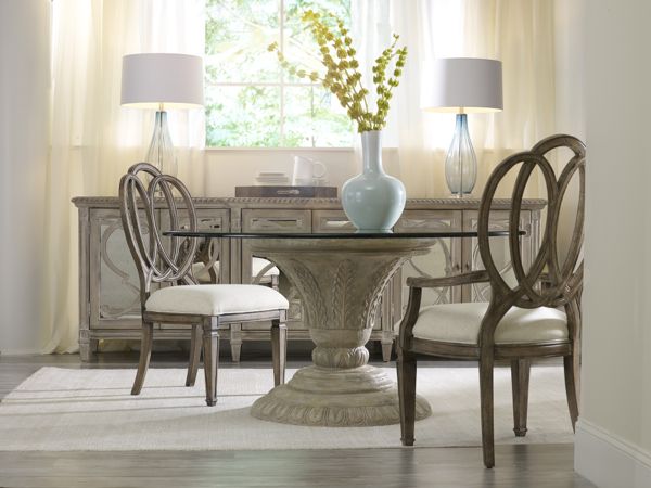 Glass–top, sculpted base Solana table is the epitome of light & airy dining