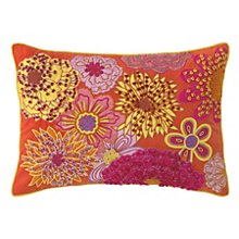 Company C’s “Pippa” pillow in coral looks rich with shots of raspberry, yellow and lilac.